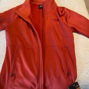 The North Face zip up jacket. Size medium. Never worn. New with tags.